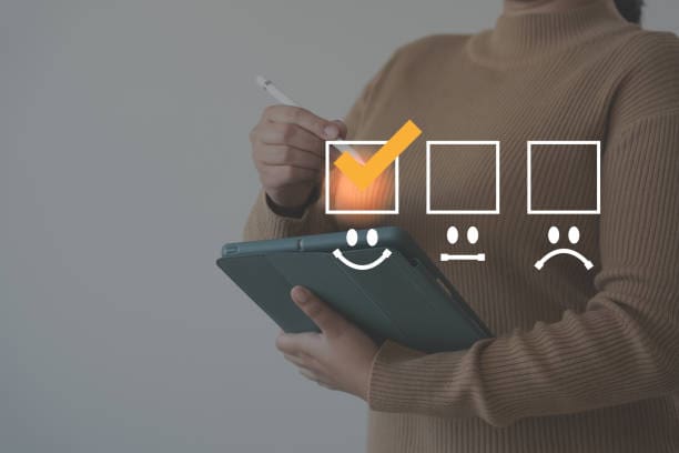 Woman holding tablet with satisfaction survey checkmarks superimposed