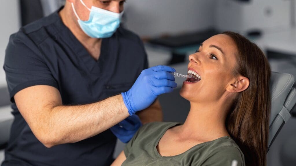 Woman being fitted with a mouthguard