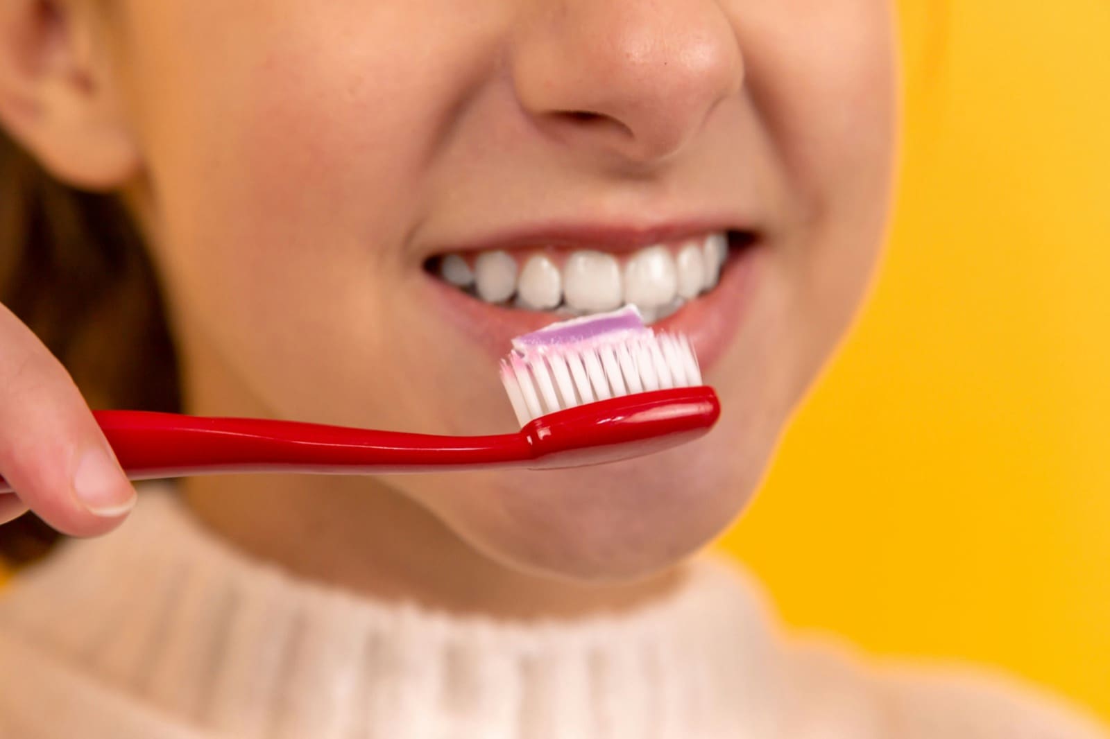Close up of young child brushing teeth