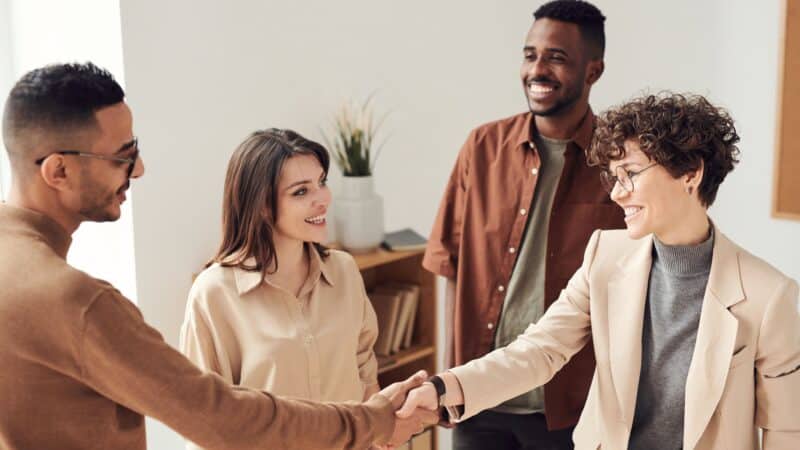 Happy people having a conversation about recommending services