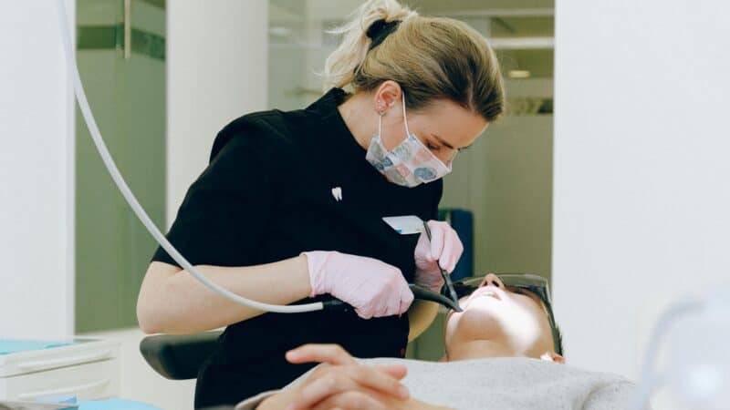 Relaxed patient receiving gentle dental care from compassionate dentist