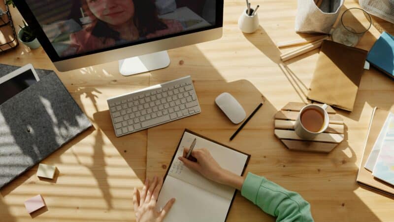 Dental practice owner checking email marketing campaign on laptop