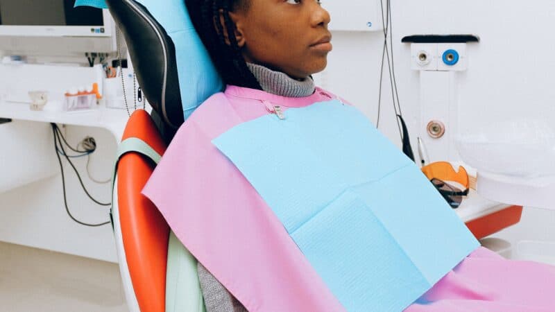 Dental hygienist performing professional teeth cleaning for gum health