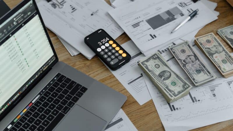 Dental practice owner reviewing pricing and financial documents