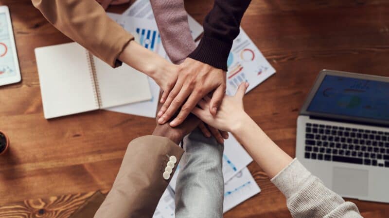 Small business owners collaborating on a cross-promotion partnership