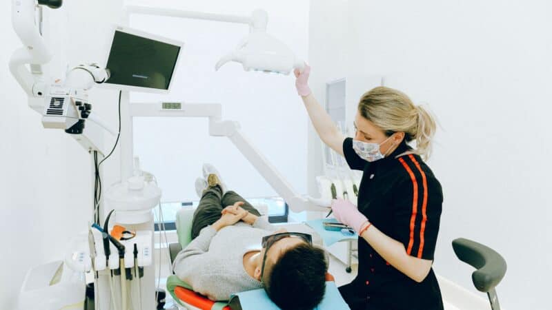 Dentist reviewing dental X-ray for wisdom teeth assessment